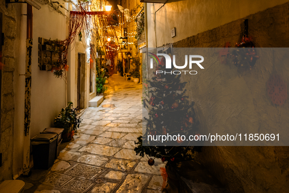 A street in the historic center of Ruvo di Puglia, Italy, on December 8, 2024, displays Christmas decorations. The courses and streets of Ru...