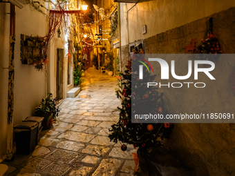 A street in the historic center of Ruvo di Puglia, Italy, on December 8, 2024, displays Christmas decorations. The courses and streets of Ru...