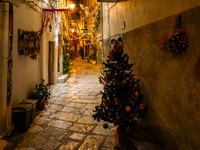 A street in the historic center of Ruvo di Puglia, Italy, on December 8, 2024, displays Christmas decorations. The courses and streets of Ru...