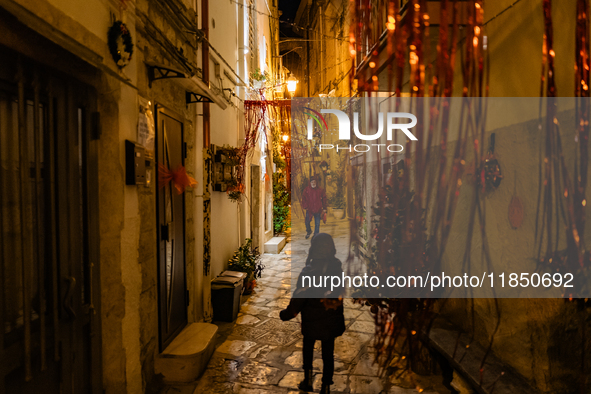 A street in the historic center of Ruvo di Puglia, Italy, on December 8, 2024, displays Christmas decorations. The courses and streets of Ru...