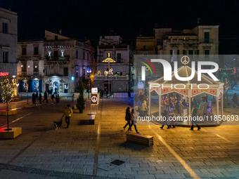 Carousel and artist lights are in Giacomo Matteotti Square in Ruvo di Puglia, Italy, on December 8, 2024. Courses and streets of Ruvo di Pug...