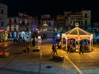 Carousel and artist lights are in Giacomo Matteotti Square in Ruvo di Puglia, Italy, on December 8, 2024. Courses and streets of Ruvo di Pug...