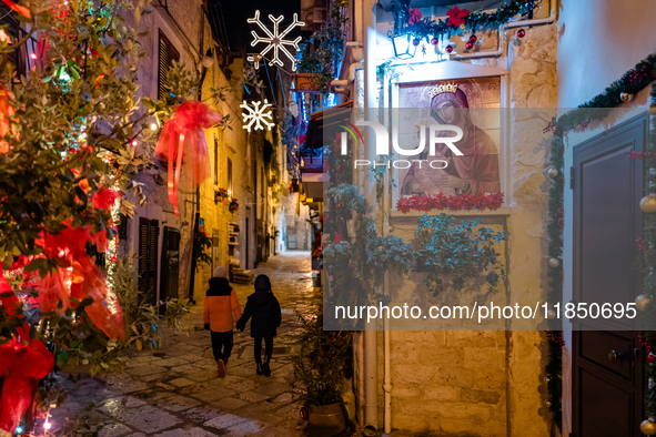 A street in the historic center of Ruvo di Puglia, Italy, on December 8, 2024, displays Christmas decorations. The courses and streets of Ru...