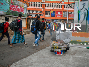 A street vendor prepares before starting the day's business near Sealdah Railway station. (