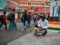 A street vendor prepares before starting the day's business near Sealdah Railway station. (