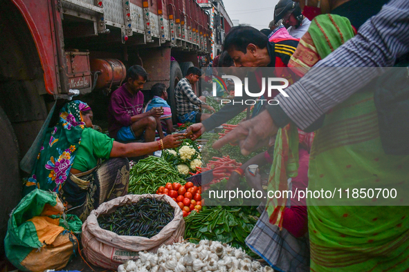 A vegetable seller sells vegetables at Koley market in Kolkata, one of the largest vegetable wholesale markets in South East Asia. 