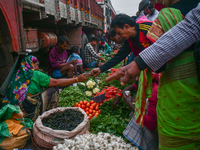 A vegetable seller sells vegetables at Koley market in Kolkata, one of the largest vegetable wholesale markets in South East Asia. (