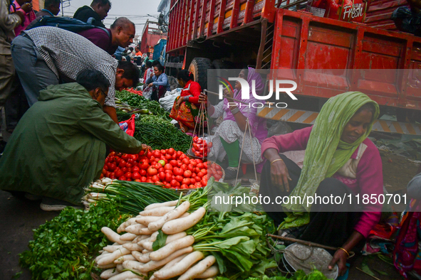 A vegetable seller sells vegetables at Koley market in Kolkata, one of the largest vegetable wholesale markets in Southeast Asia. 