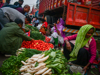 A vegetable seller sells vegetables at Koley market in Kolkata, one of the largest vegetable wholesale markets in Southeast Asia. (