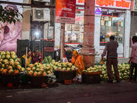 A vegetable seller sells cauliflower at a roadside shop in Kolkata. (