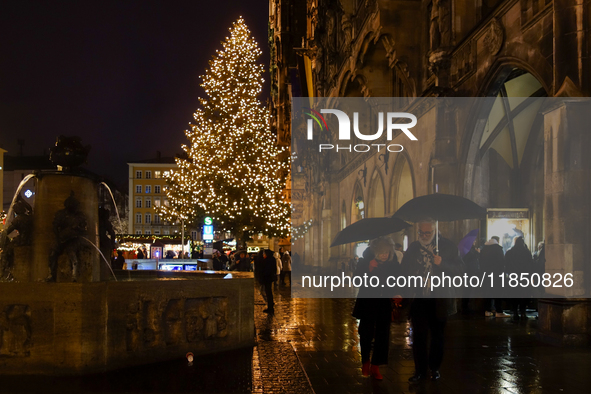 The Christmas Market at Marienplatz in front of Munich's Town Hall in Munich, Bavaria, Germany, on December 8, 2024, shines in the festive s...