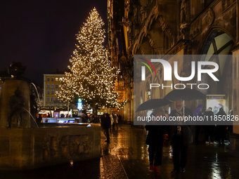 The Christmas Market at Marienplatz in front of Munich's Town Hall in Munich, Bavaria, Germany, on December 8, 2024, shines in the festive s...