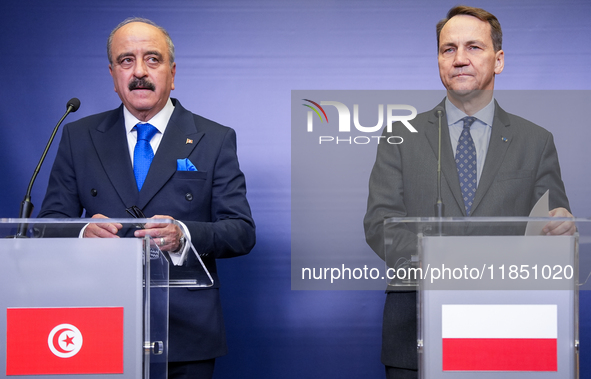 Mohamed Ali Nafti Tunisia's Minister of Foreign Affairs and Radoslaw Sikorski Poland's Minister of Foreign Affairs during press conference i...