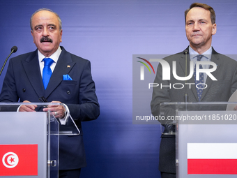 Mohamed Ali Nafti Tunisia's Minister of Foreign Affairs and Radoslaw Sikorski Poland's Minister of Foreign Affairs during press conference i...