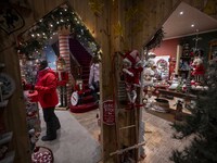 A person looks at decorations at a Christmas market in the town of Akureyri, Iceland, on November 30, 2024. Christmas in Iceland, known as J...