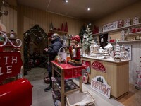 A person looks at decorations at a Christmas market in the town of Akureyri, Iceland, on November 30, 2024. Christmas in Iceland, known as J...