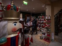 Several people look at decorations at a Christmas market in the town of Akureyri, Iceland, on November 30, 2024. Christmas in Iceland, known...