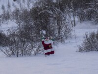 A sign with a Santa Claus figure indicates the location address of a Christmas market in the town of Akureyri, Iceland, on November 30, 2024...