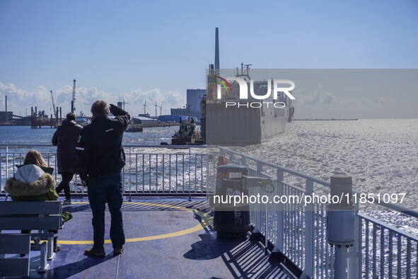 People look at the Esbjerg port in Nordby, Fano Island, Denmark, on April 29, 2024 