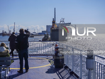 People look at the Esbjerg port in Nordby, Fano Island, Denmark, on April 29, 2024 (