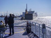 People look at the Esbjerg port in Nordby, Fano Island, Denmark, on April 29, 2024 (