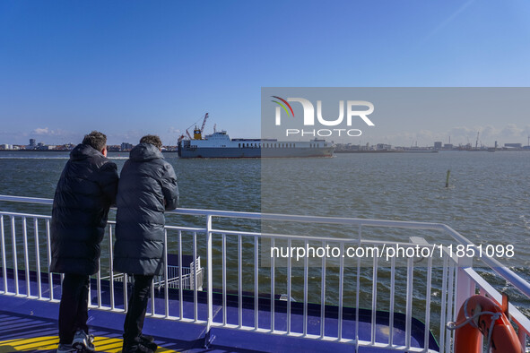 People look at the Esbjerg port in Nordby, Fano Island, Denmark, on April 29, 2024 