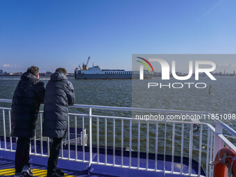 People look at the Esbjerg port in Nordby, Fano Island, Denmark, on April 29, 2024 (