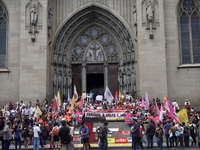 People hold crosses during a demonstration in downtown Sao Paulo, Brazil, on December 9, 2024, to protest against police violence following...