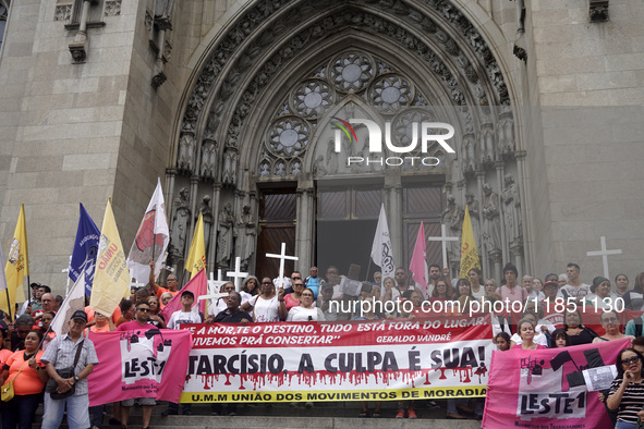 People hold crosses during a demonstration in downtown Sao Paulo, Brazil, on December 9, 2024, to protest against police violence following...