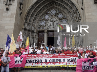 People hold crosses during a demonstration in downtown Sao Paulo, Brazil, on December 9, 2024, to protest against police violence following...