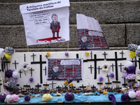 People hold crosses during a demonstration in downtown Sao Paulo, Brazil, on December 9, 2024, to protest against police violence following...