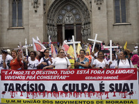 People hold crosses during a demonstration in downtown Sao Paulo, Brazil, on December 9, 2024, to protest against police violence following...