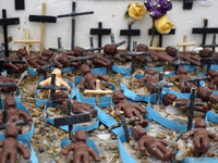 People hold crosses during a demonstration in downtown Sao Paulo, Brazil, on December 9, 2024, to protest against police violence following...