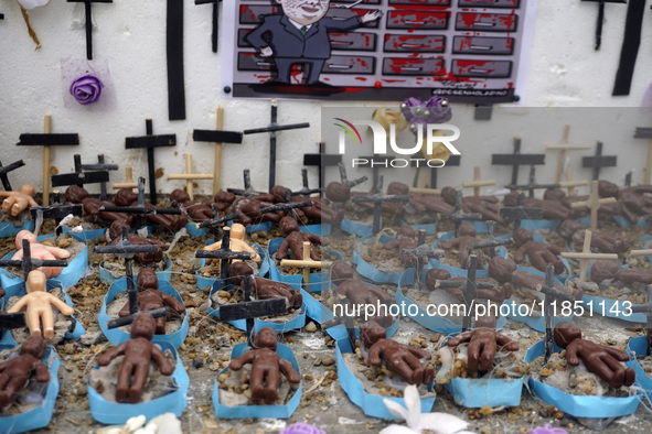 People hold crosses during a demonstration in downtown Sao Paulo, Brazil, on December 9, 2024, to protest against police violence following...