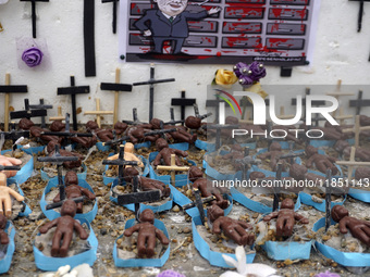 People hold crosses during a demonstration in downtown Sao Paulo, Brazil, on December 9, 2024, to protest against police violence following...