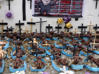 People hold crosses during a demonstration in downtown Sao Paulo, Brazil, on December 9, 2024, to protest against police violence following...