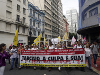 People hold crosses during a demonstration in downtown Sao Paulo, Brazil, on December 9, 2024, to protest against police violence following...