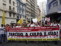 People hold crosses during a demonstration in downtown Sao Paulo, Brazil, on December 9, 2024, to protest against police violence following...