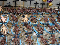 People hold crosses during a demonstration in downtown Sao Paulo, Brazil, on December 9, 2024, to protest against police violence following...