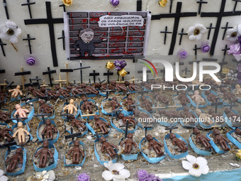 People hold crosses during a demonstration in downtown Sao Paulo, Brazil, on December 9, 2024, to protest against police violence following...