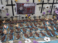 People hold crosses during a demonstration in downtown Sao Paulo, Brazil, on December 9, 2024, to protest against police violence following...