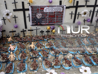 People hold crosses during a demonstration in downtown Sao Paulo, Brazil, on December 9, 2024, to protest against police violence following...