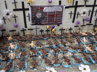 People hold crosses during a demonstration in downtown Sao Paulo, Brazil, on December 9, 2024, to protest against police violence following...