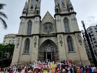 People hold crosses during a demonstration in downtown Sao Paulo, Brazil, on December 9, 2024, to protest against police violence following...