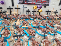 People hold crosses during a demonstration in downtown Sao Paulo, Brazil, on December 9, 2024, to protest against police violence following...