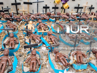 People hold crosses during a demonstration in downtown Sao Paulo, Brazil, on December 9, 2024, to protest against police violence following...