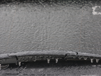 Ice covers the windshield of a vehicle as freezing rain causes surfaces to be coated with a sheet of ice in Toronto, Ontario, Canada, on Dec...