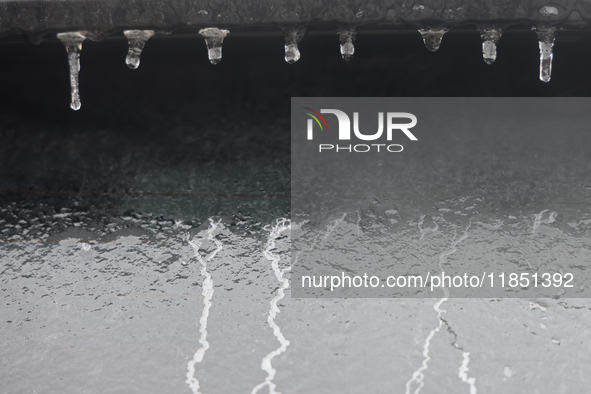 Ice covers the rear window of a vehicle as freezing rain causes surfaces to be coated with a sheet of ice in Toronto, Ontario, Canada, on De...