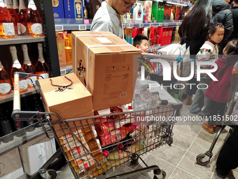 Customers shop at Pangdonglai (DL) store in Xuchang, China, on December 7, 2024. (