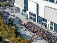 Customers line up in front of a Pangdonglai (DL) store in Xuchang, China, on December 7, 2024. (